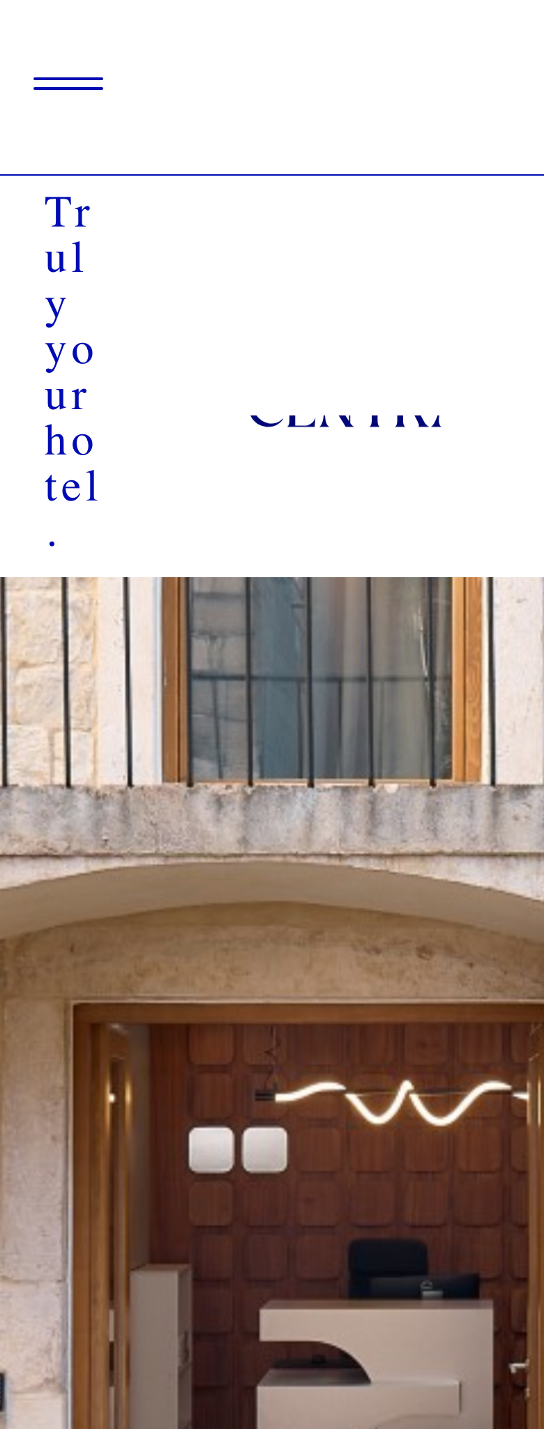 Mobilehomepage, 'Trulyyourhotel.'overtheCentralwordmarkandaphotoofthepalazzofacadeandpanelledlobbyreception.