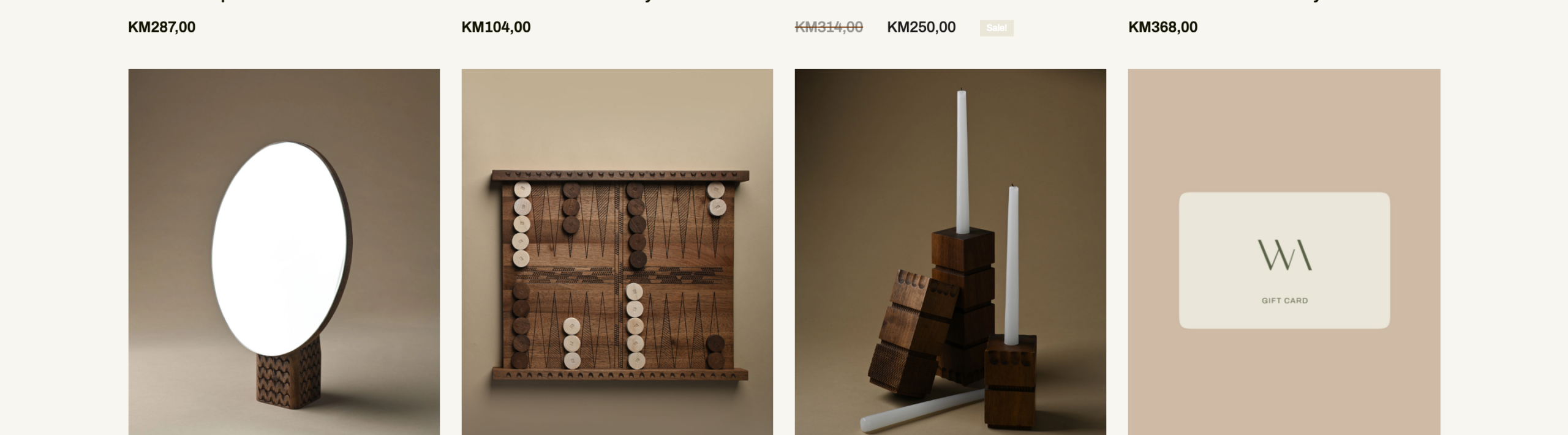 WAGAproductshowcasegridfeaturingasculpturalovalwallmirror,acarvedservingboardset,woodencandleholdersandaWAGAgiftcard,presentedonmutedbeigestudiobackgroundswithKMprices